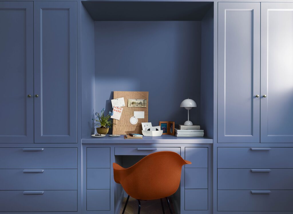 An office and desk area is painted with Benjamin Moore Blue Nova paint,