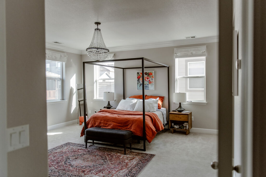 A bedroom is painted with SW Agreeable Gray