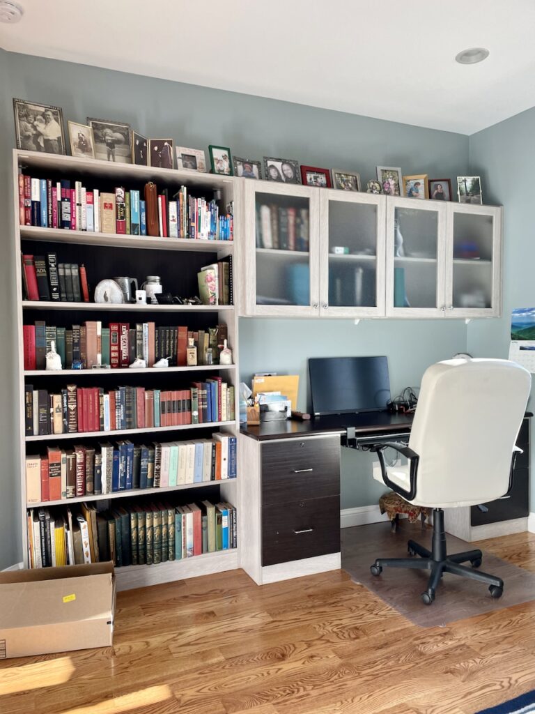 An office is painted with Benjamin Moore Mount Saint Anne wall paint, one of the best blue-gray paint colors on the market.