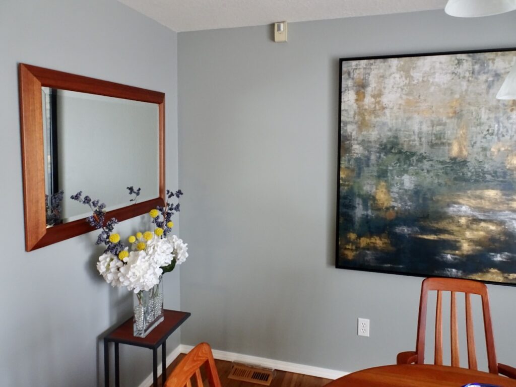 A dining room is painted with SW Mineral Deposit, one of the best blue-gray paint colors from Sherwin-Williams.