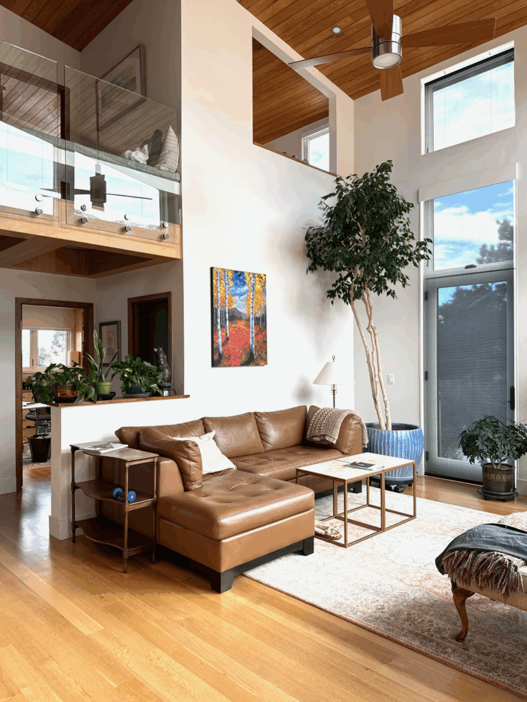 A BM Seapearl living room with high ceilings.