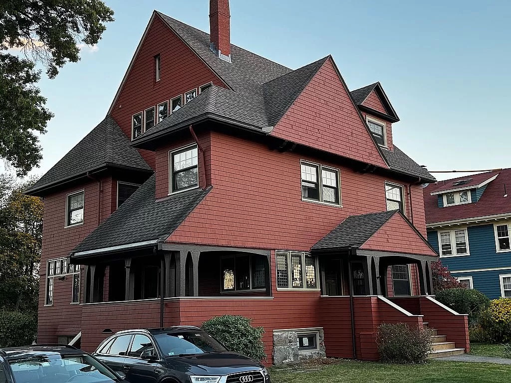 A Boston home features a BM Earthly Russet brown exterior color palette.