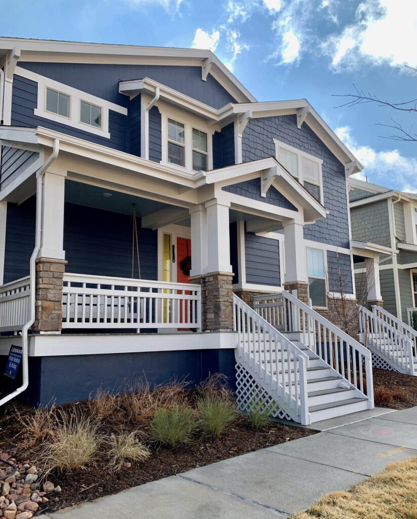 A home features SW Charcoal Blue exterior color palette.
