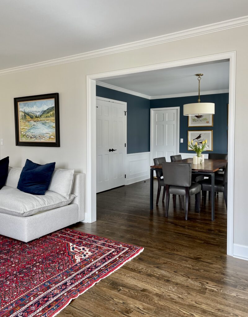 A Britannia Blue dining room is visible from a BM Classic Gray living room.
