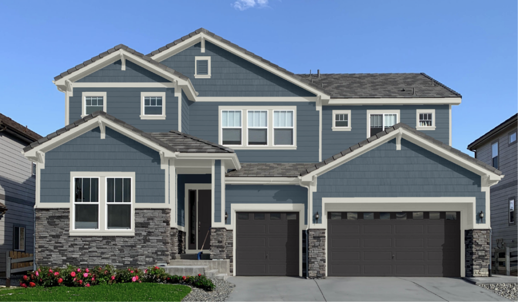 A home features paint colors that go with cool gray stone, including SW Needlepoint Navy siding and SW Deep Forest Brown garage doors.