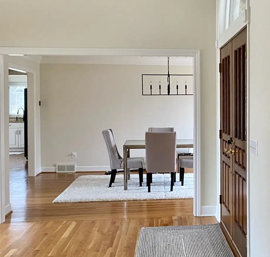 A dining room is painted with Sherwin-Williams White Duck walls.