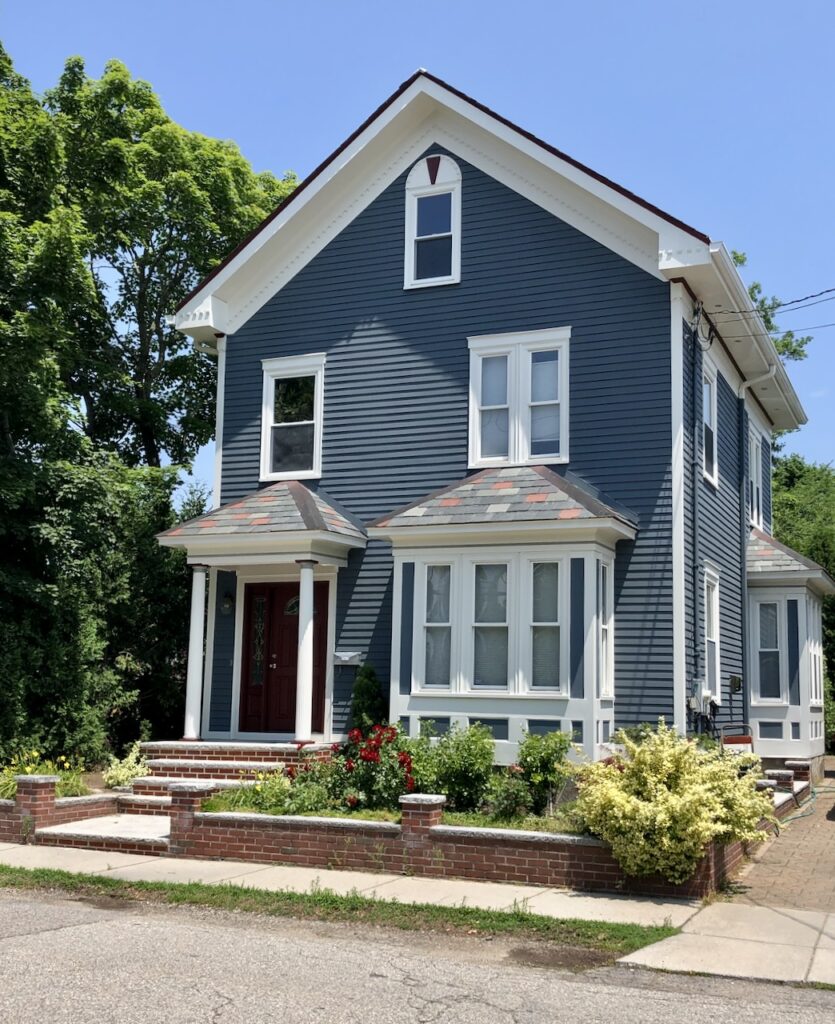 A home features a SW Grays Harbor blue exterior color palette.