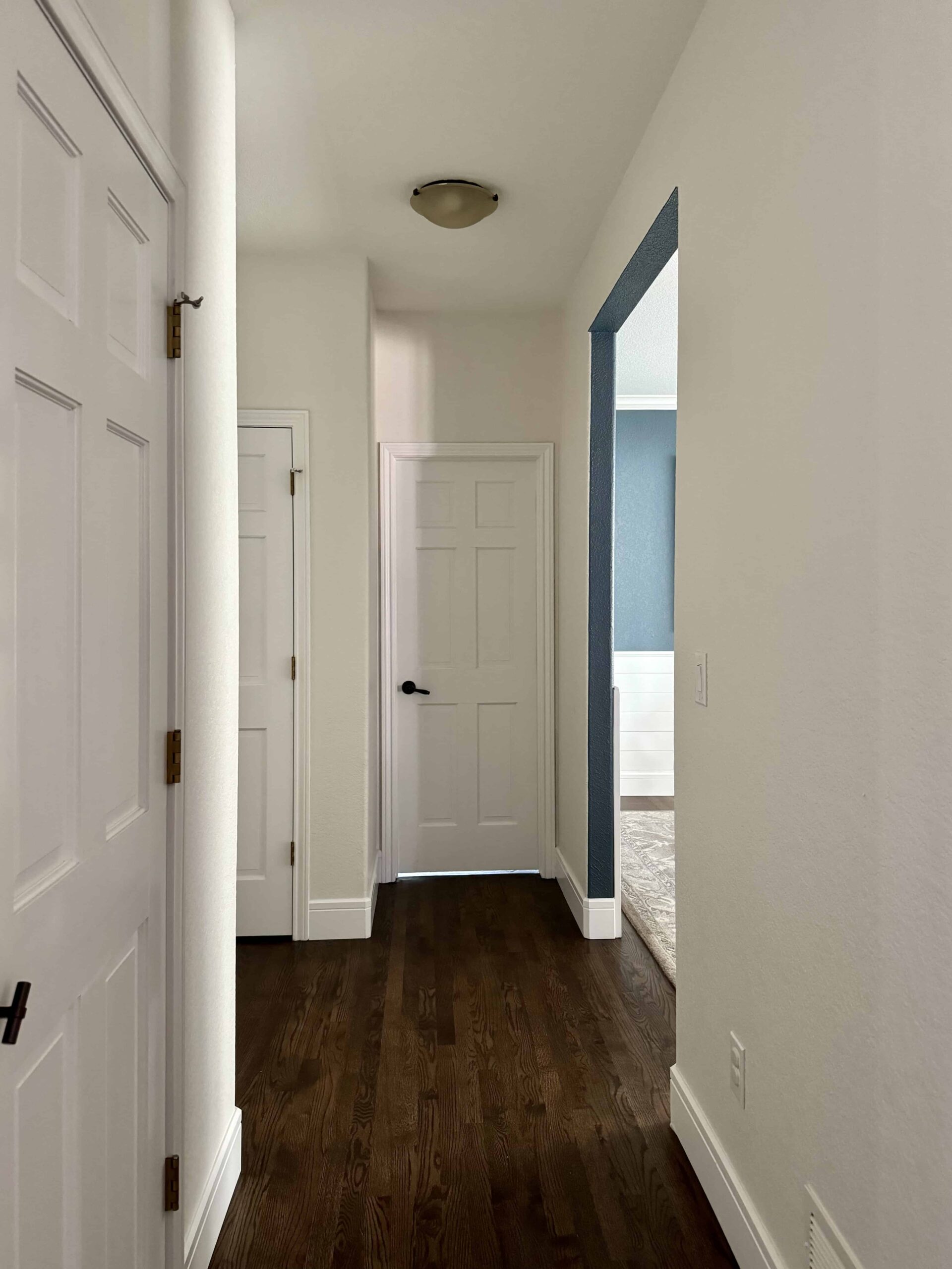 A hallway is painted with SW Pearly White