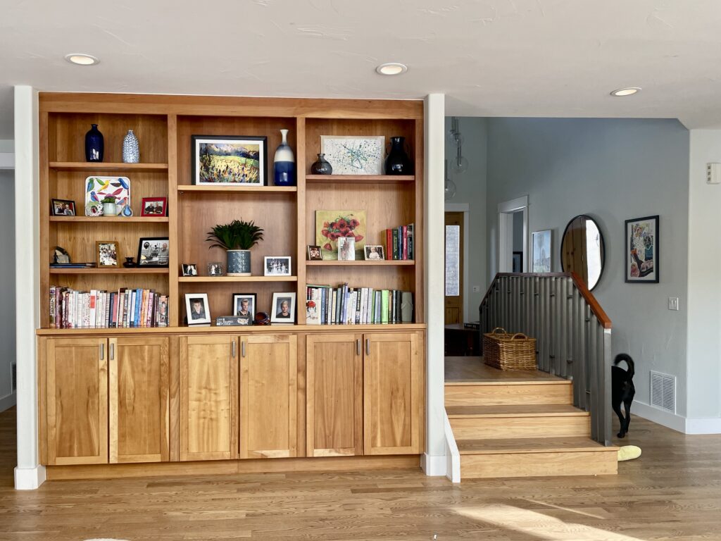 A home features natural wood cabinets with Benjamin Moore Titanium painted walls.