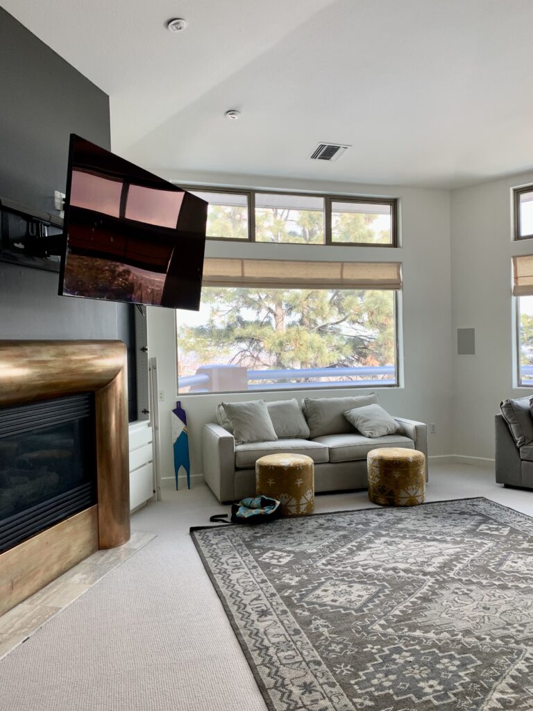 A master bedroom features a Benjamin Moore Iron Mountain accent wall.