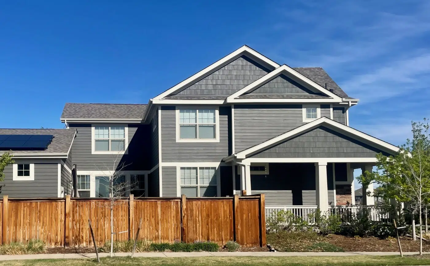 A home is painted with SW Urbane Bronze exterior paint.