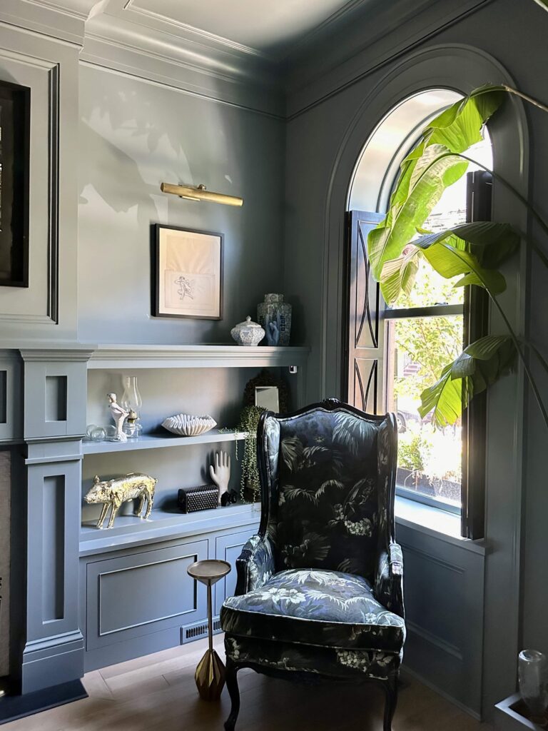 A living room is color drenched with Farrow & Ball de Nimes paint.