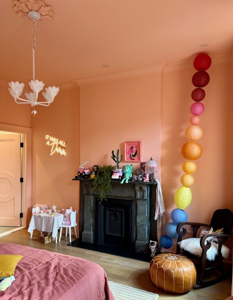 A girl's bedroom features color drenching with Clare Paint Pop paint color.