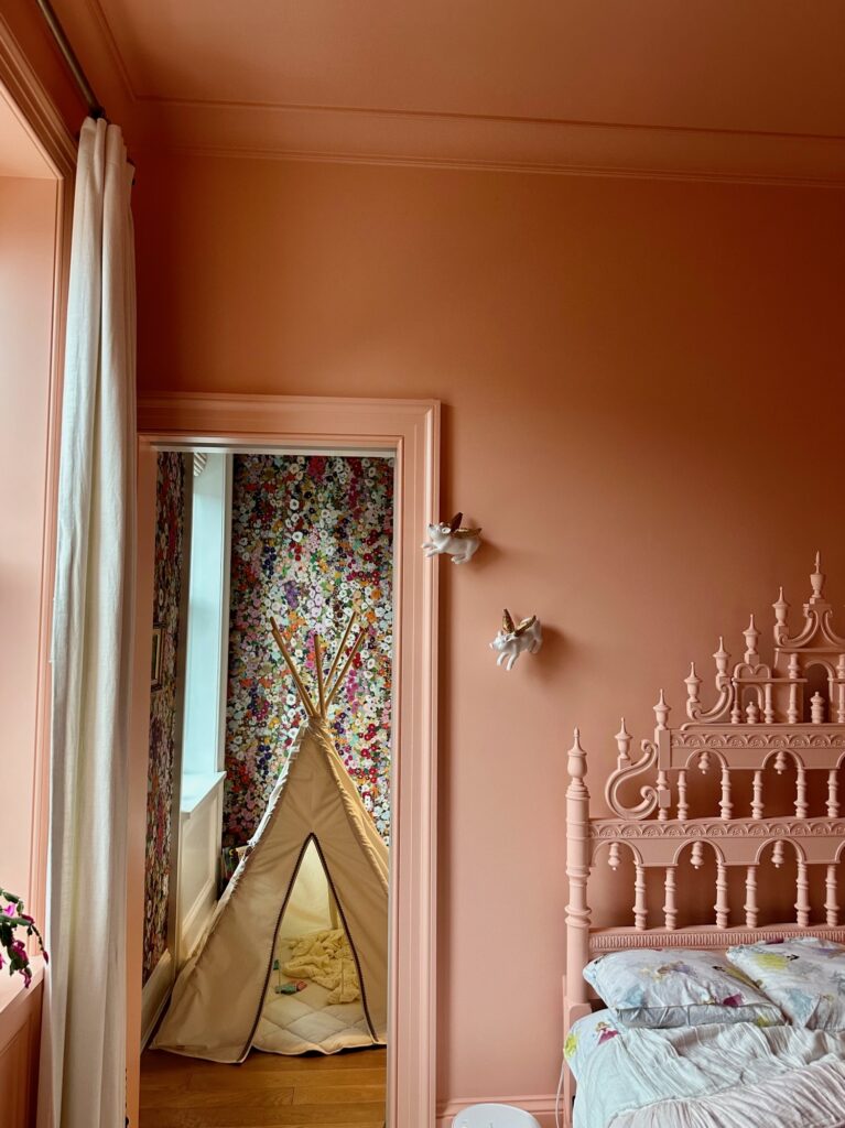 A girl's bedroom features color drenching with Clare Paint Pop paint color.