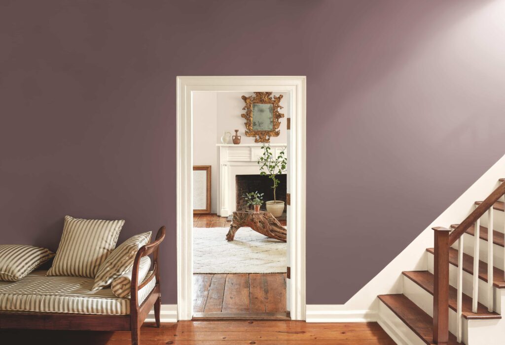 A living room and stairwell painted with BM Cinnamon Slate paint. 