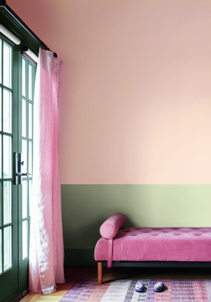 A girl's bedroom features BM Tissue Pink walls with BM Rosepine half accent wall. 