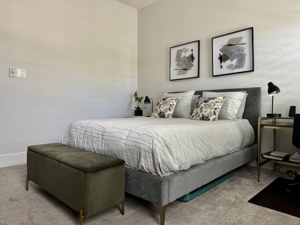 A guest bedroom is painted with Sherwin-Williams Egret White paint.