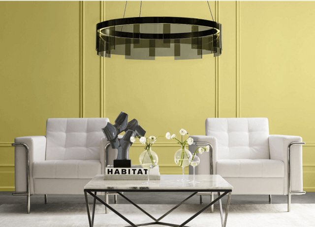 A living room painted with Sherwin-Williams Chartreuse paint, part of the Sherwin-Williams 2025 Color of the Year Capsule.