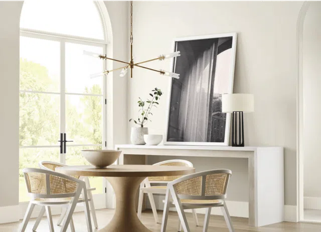 A dining room painted with Sherwin-Williams Sunbleached paint, part of the Sherwin-Williams 2025 Color of the Year Capsule.