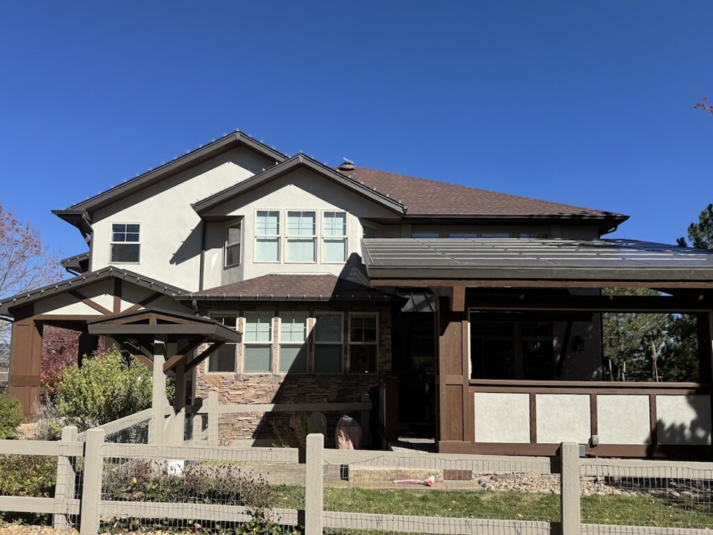 A home features SW Dark Brown exterior trim with SW Accessible Beige siding paint. 