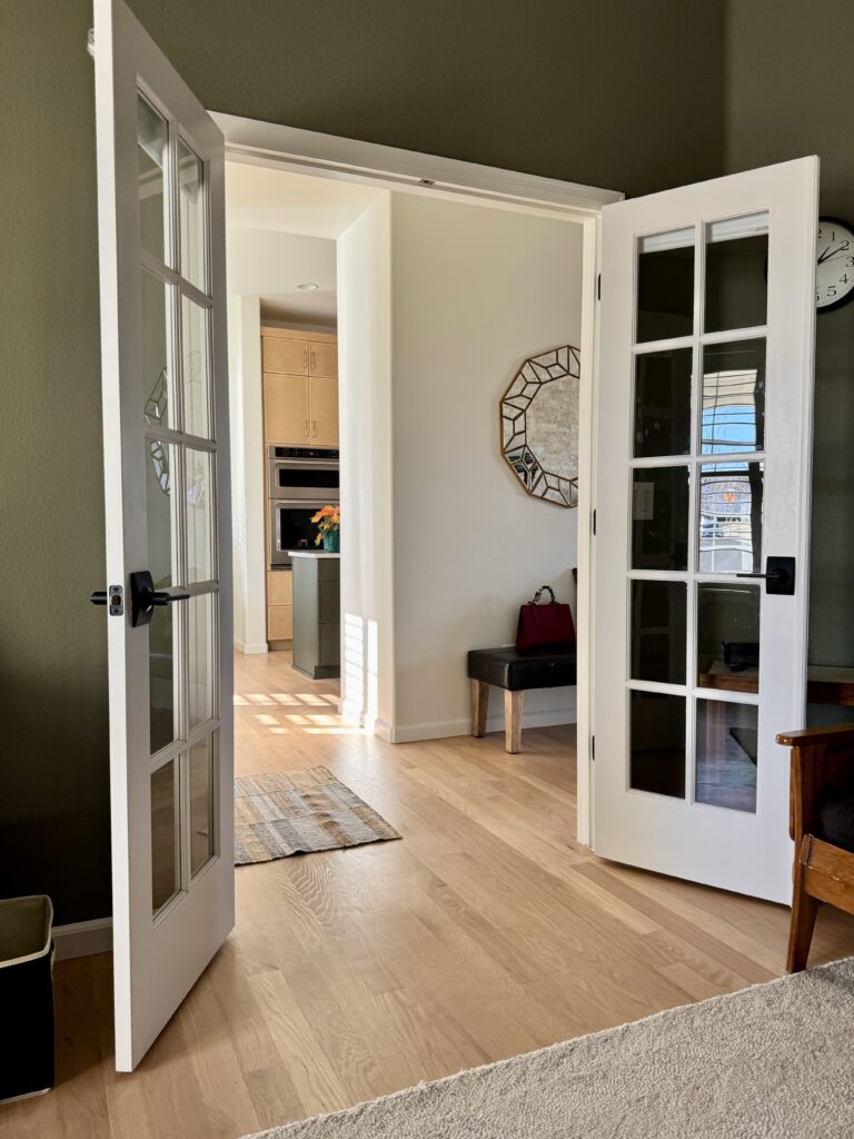 A view from a BM Tate Olive office through to an SW Alabaster hallway.