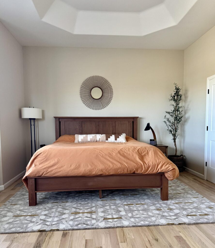 SW Chrysanthemum bedspread in a bedroom painted with BM Natural Linen, part of this SW Alabaster whole-house color palette