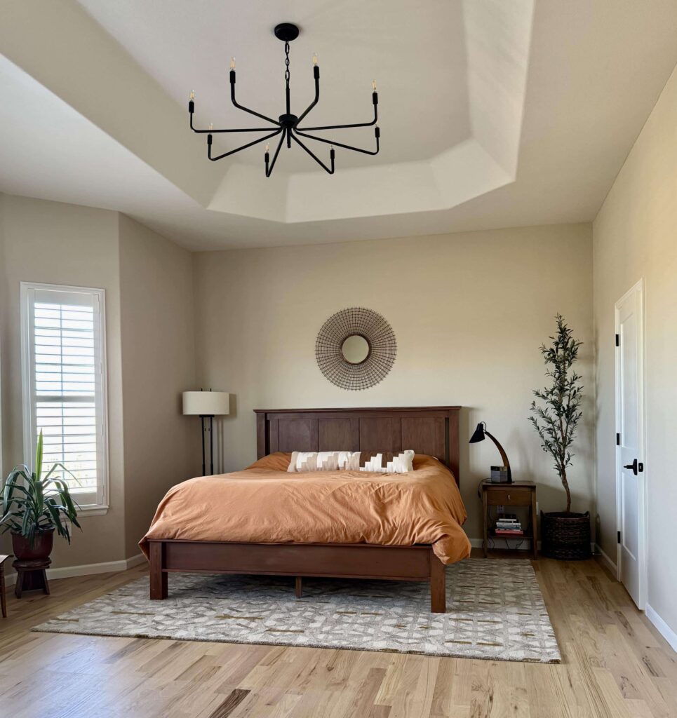 A bedroom is painted with Benjamin Moore Natural Linen paint. 