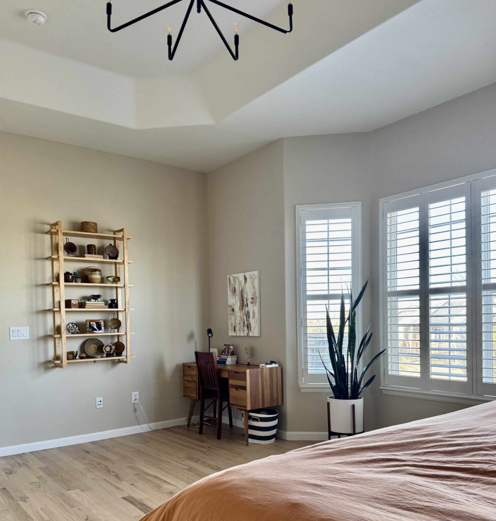 A bedroom features BM Natural Linen paint. 