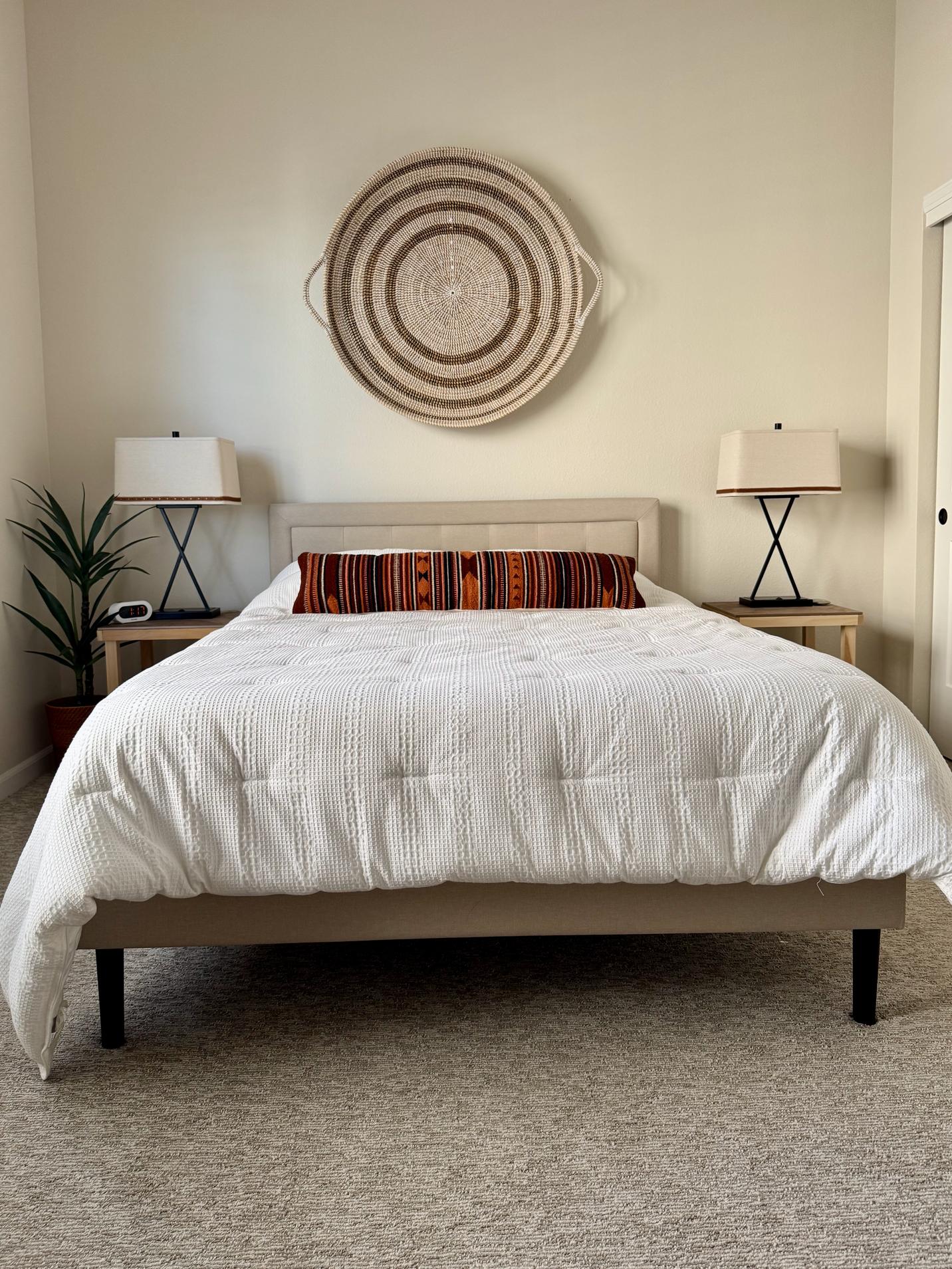 A bedroom is painted with BM Maritime White paint.