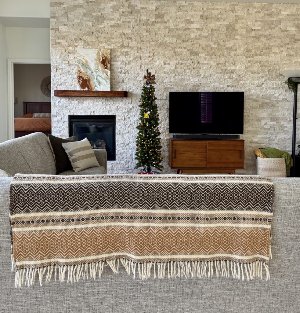 A SW Alabaster living room features rust accent colors, part of an Alabaster whole-house color palette.