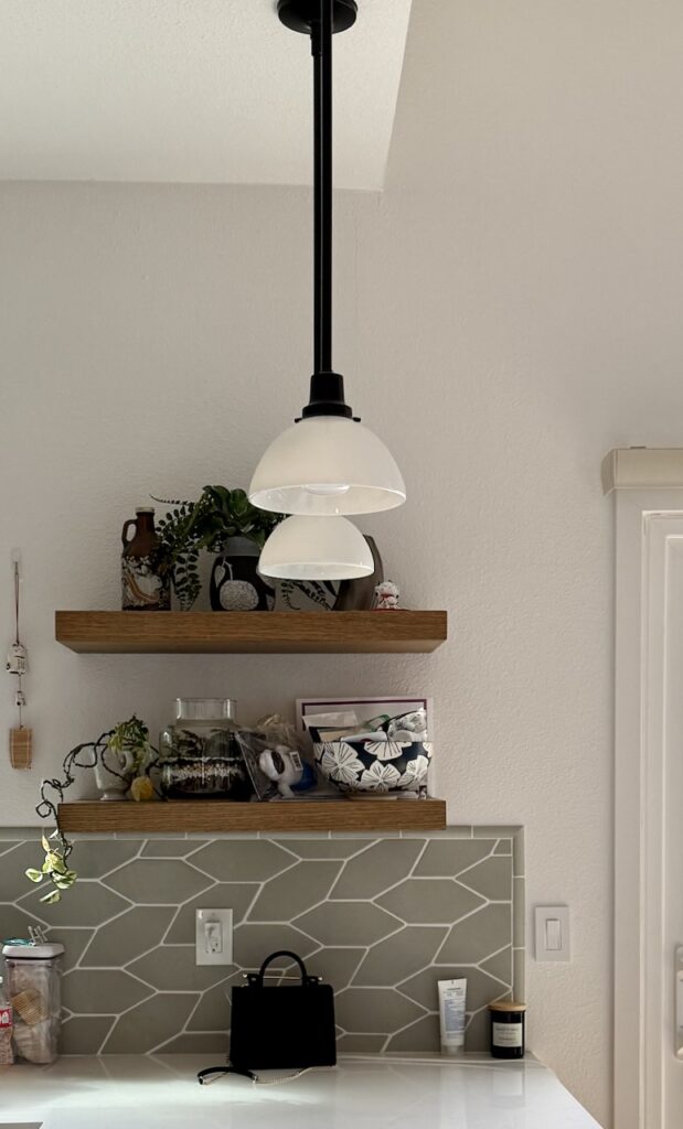 A view of kitchen walls painted with Sherwin-Williams Snowbound, a warm off-white with taupe and pink undertones.