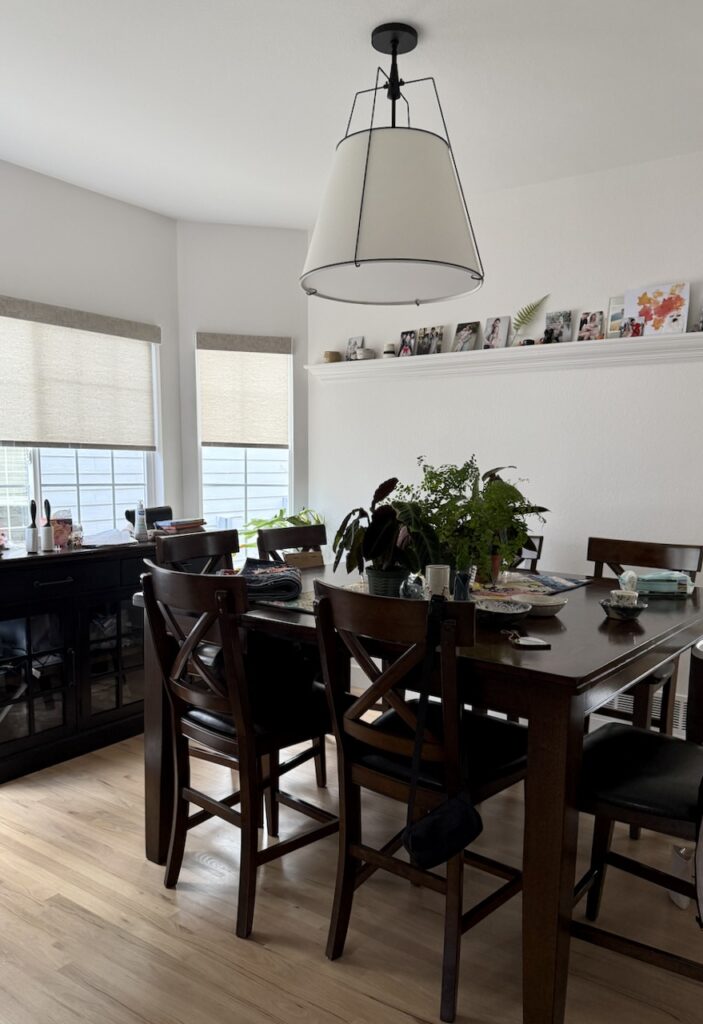 A dining room painted with Sherwin-Williams Snowbound, part of a Snowbound color palette. 