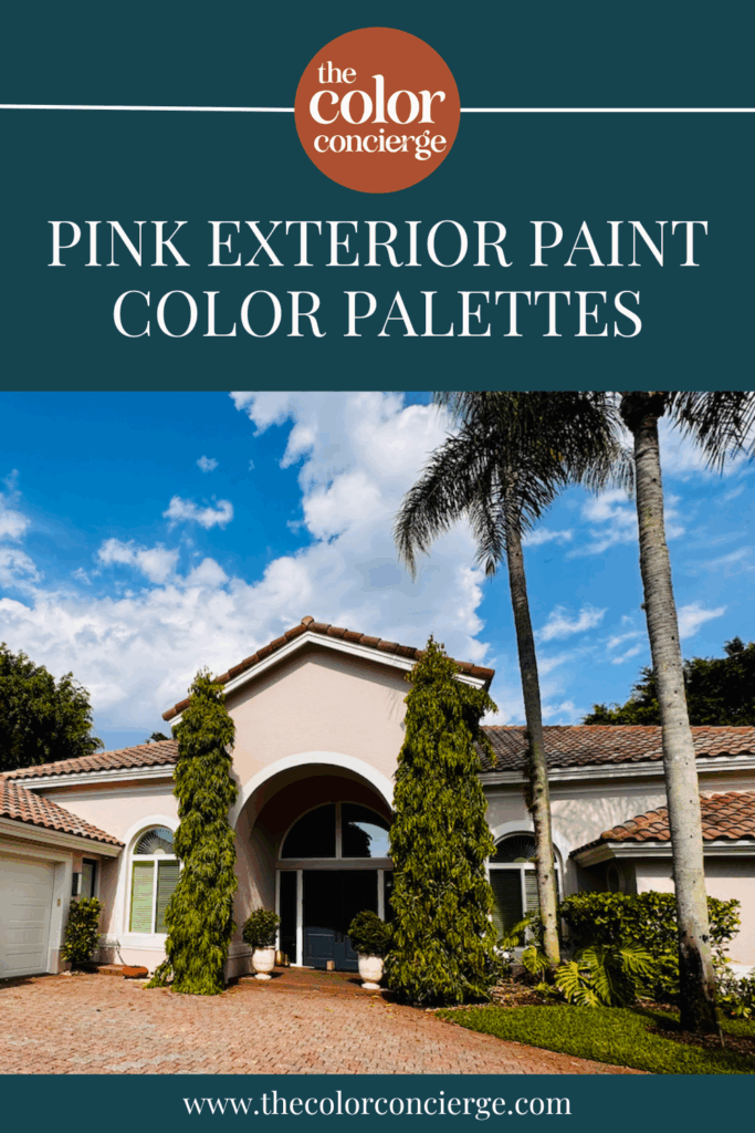 A stucco home with pink exterior paint