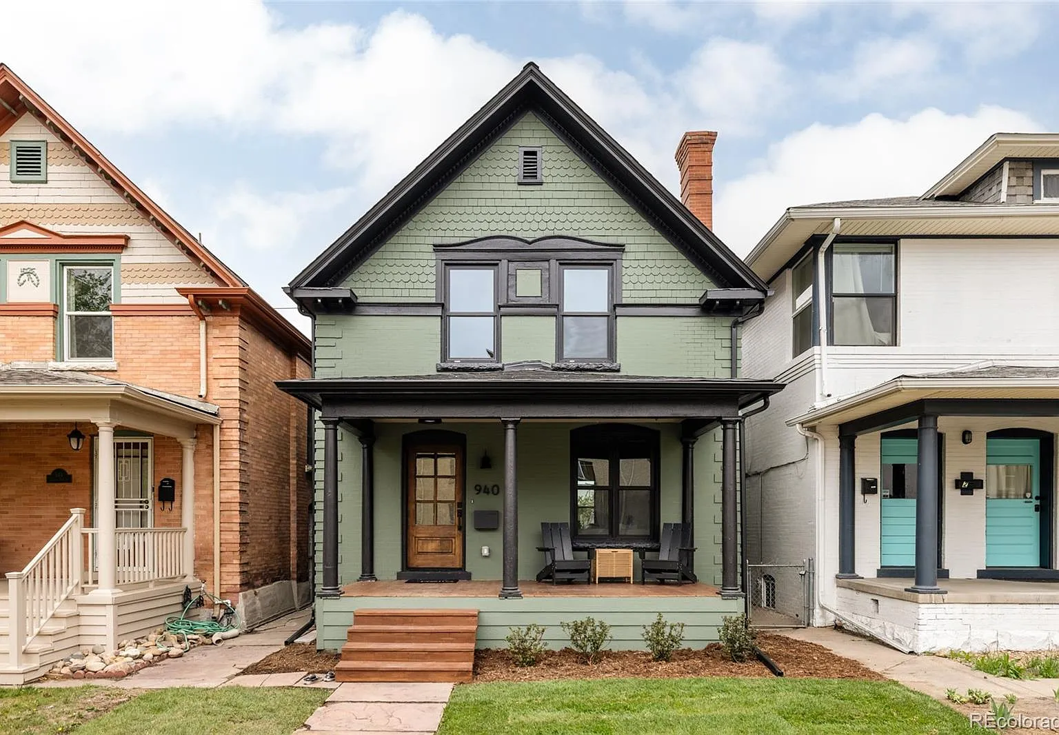 A home features Sherwin-Williams Rosemary exterior paint, a gorgeous moody green paint color.