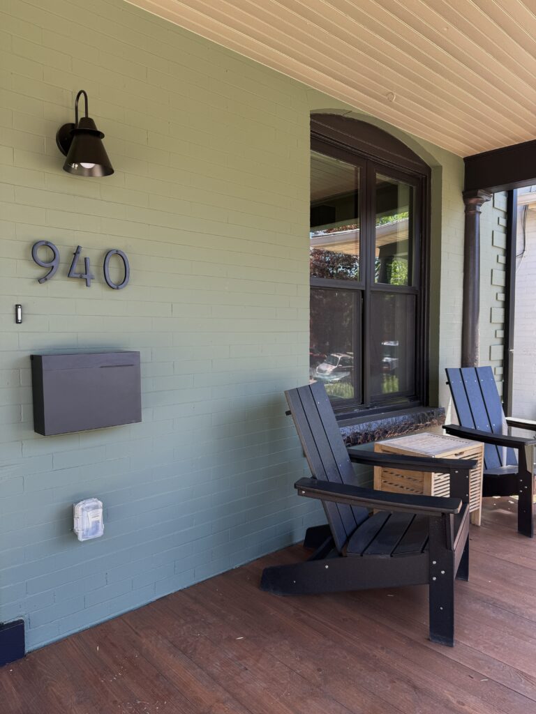 A front porch with Sherwin-Williams Rosemary exterior paint, SW Fawn Brindle porch ceiling and SW Fairfax Brown porch floor.
