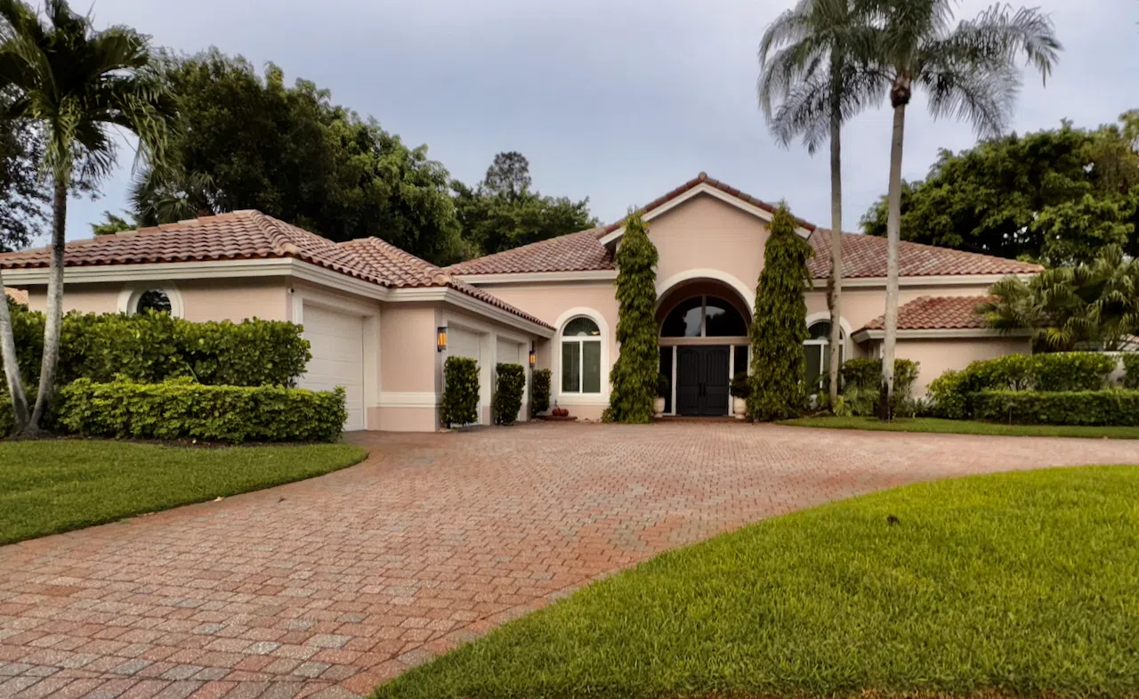A home features a warm pink exterior paint color, SW Abalone Shell.