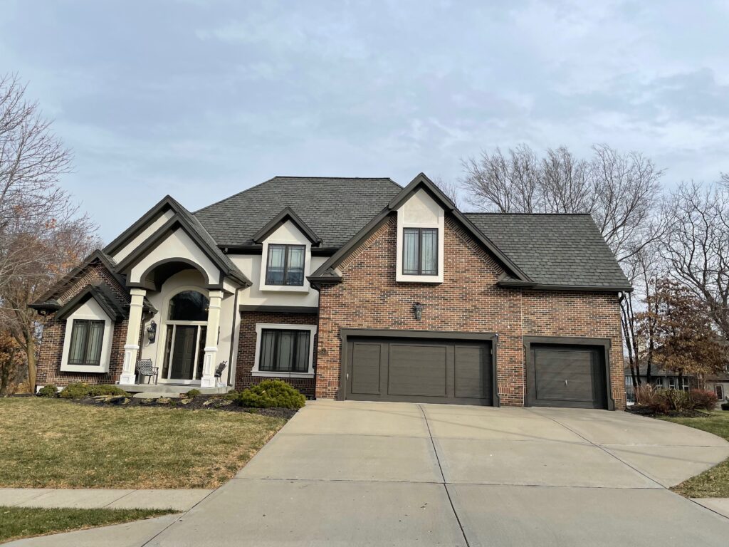 An exterior color palette featuring SW Shoji White exterior paint, SW Urbane Bronze trim and red brick exterior.