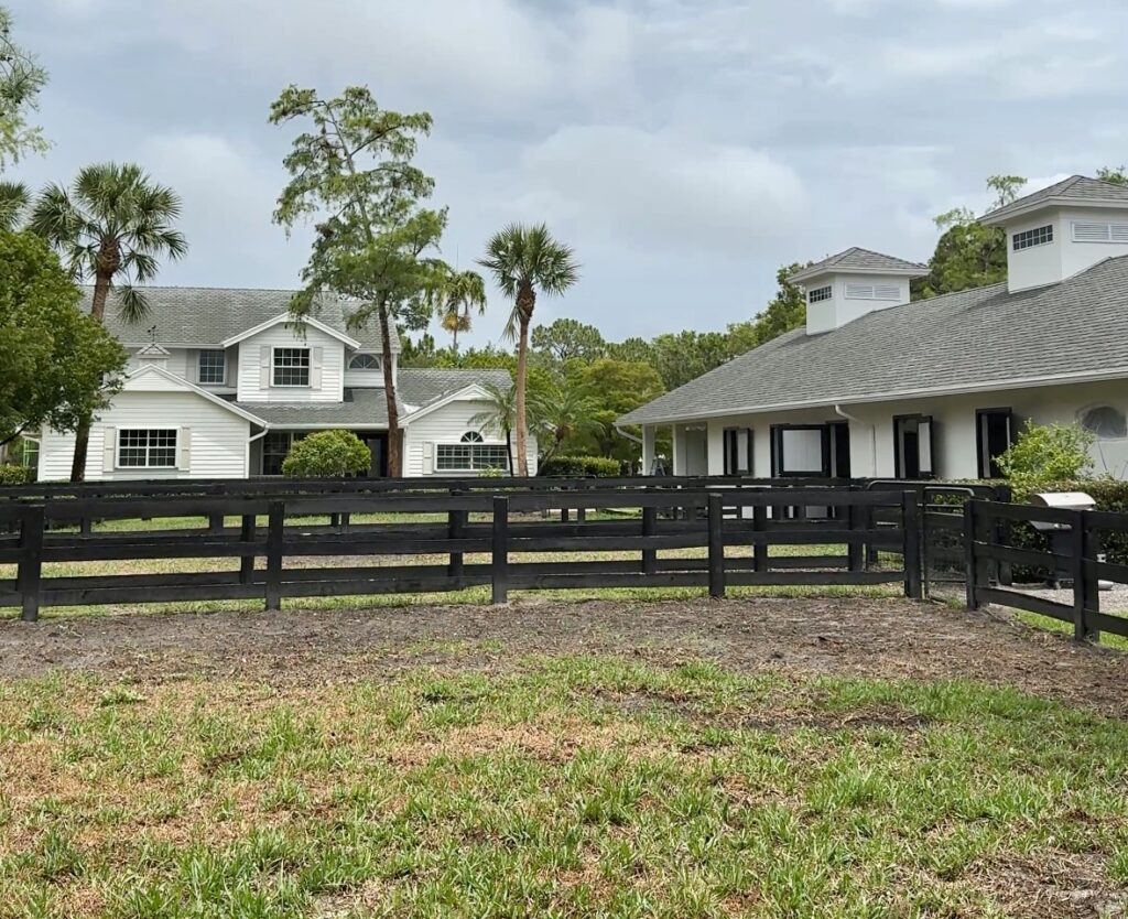 A Florida home features a BM Swiss Coffee exterior paint color palette.