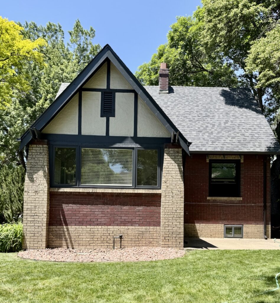 A Denver Tudor exterior with Black Metal Windows.