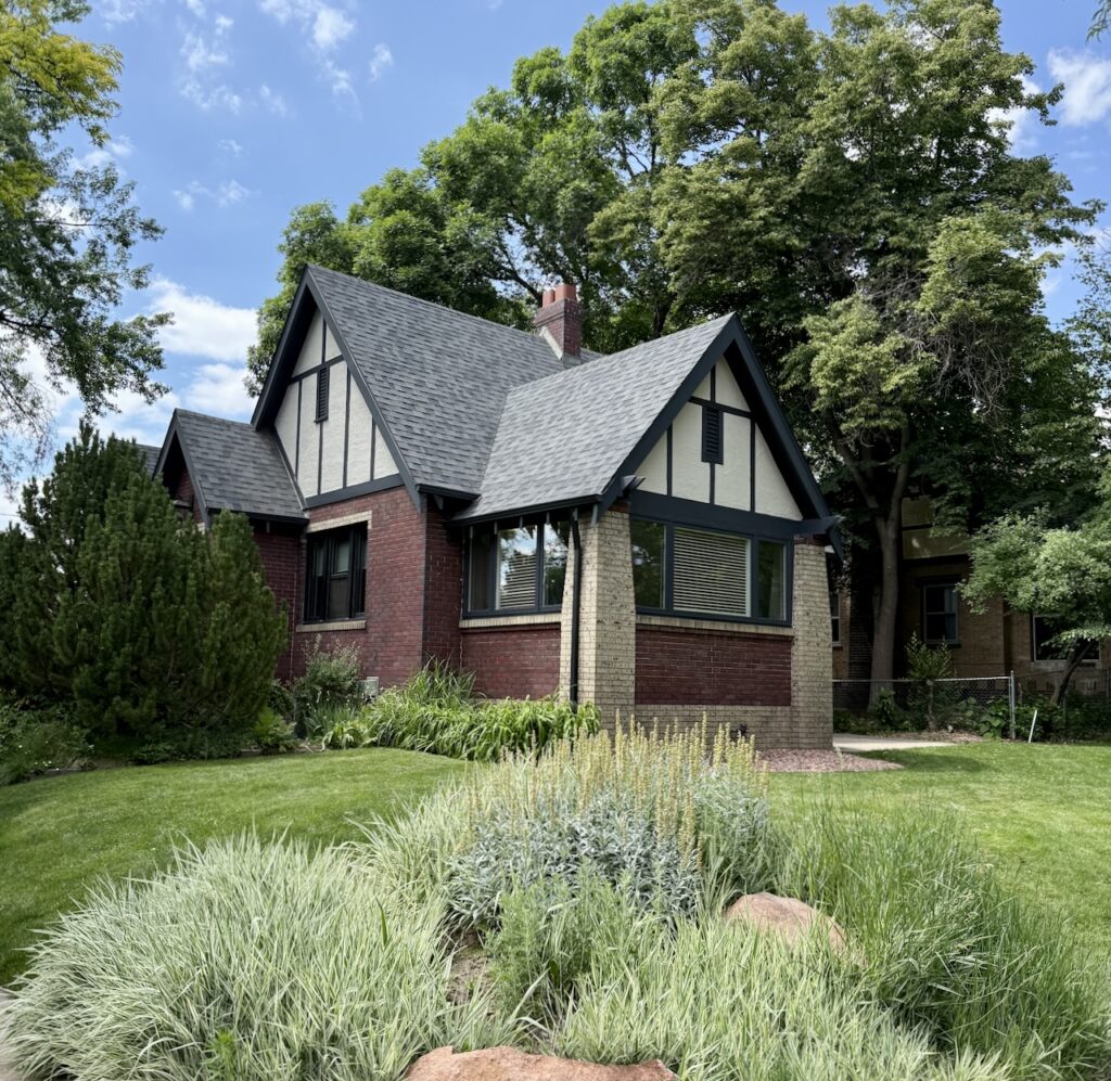 A Denver Tudor home features two different kinds of brick finishes.