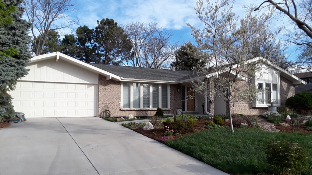 A home is painted with Sherwin-Williams Neutral Ground exterior paint.
