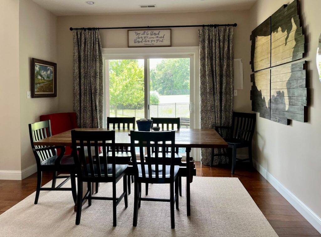 A dining room painted with SW Natural Linen paint.