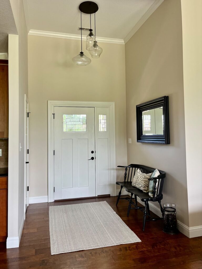 An entryway painted with Sherwin-Williams Natural Linen paint. 