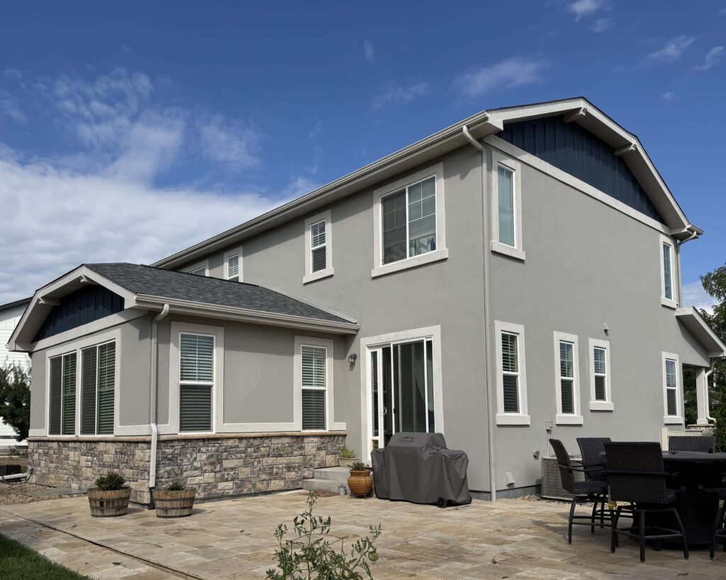A home features SW Modern Gray exterior trim with SW Dorian Gray siding.