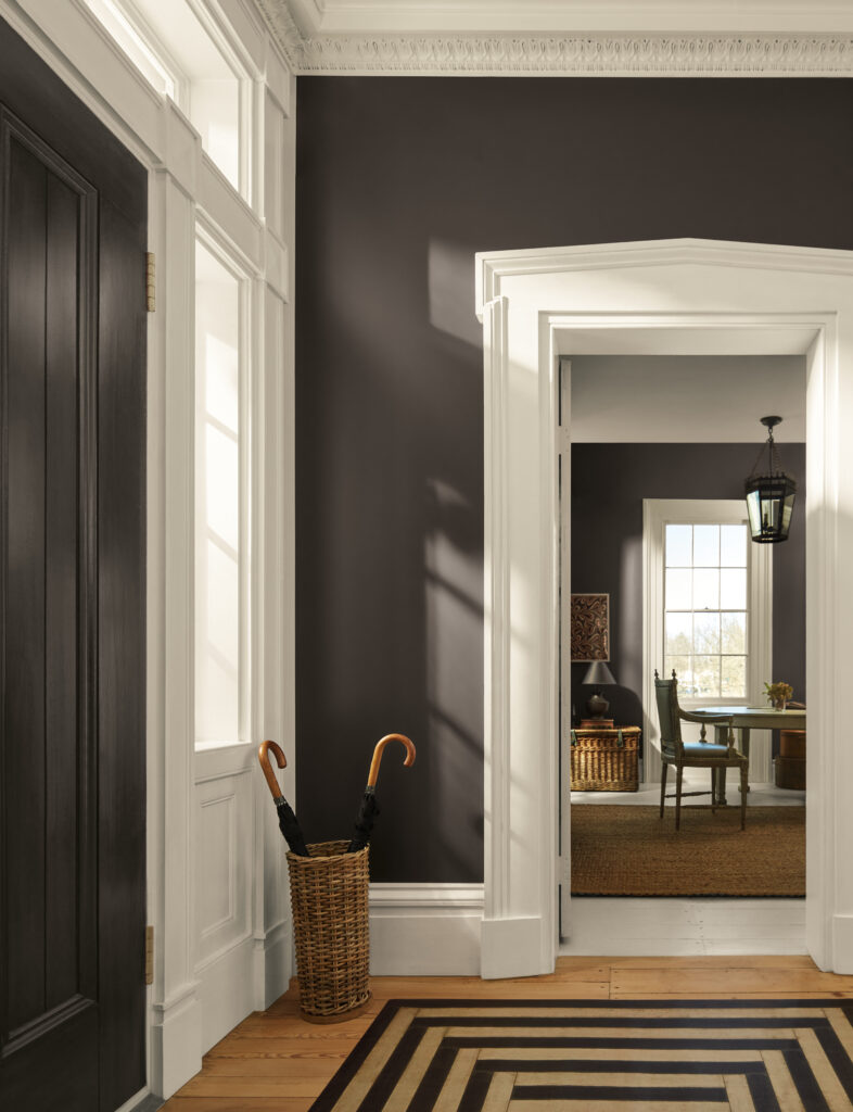 An entryway features BM Silhouette walls and BM Swiss Coffee trim. 