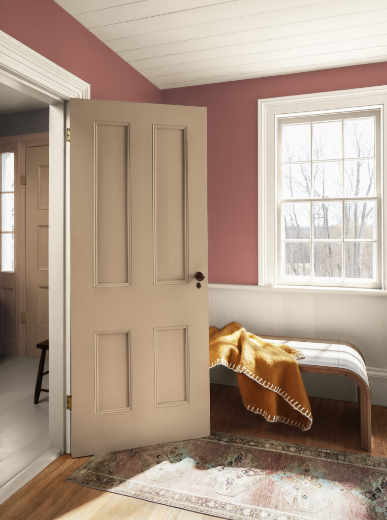 A bedroom features BM Southwest Pottery paint. Explore the full 2026 Color Trends palette in this guide from The Color Concierge.