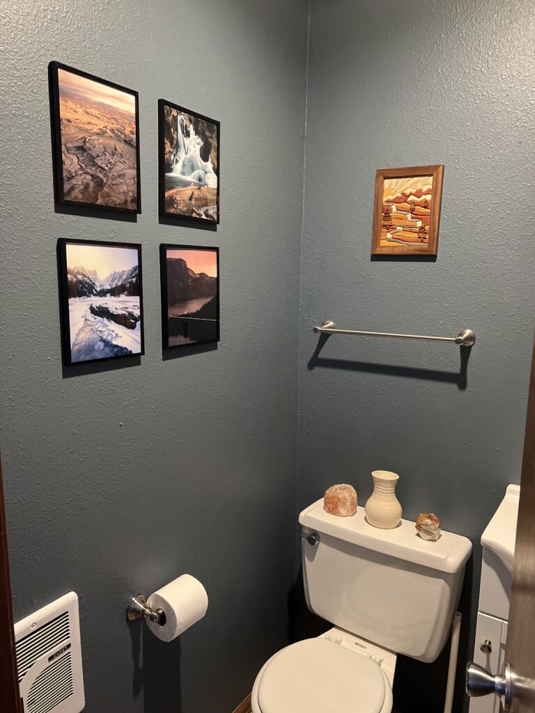 A bathroom is painted with BM Blue Spruce paint.