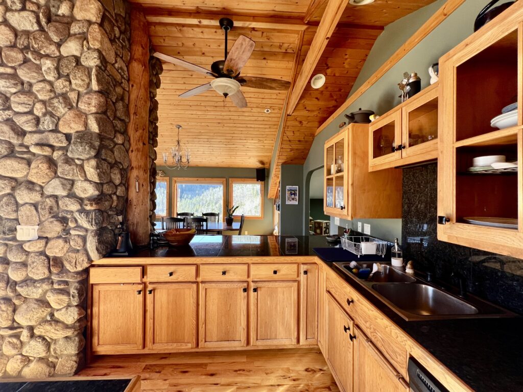 A kitchen with Cambridge Green walls and warm wood tones.