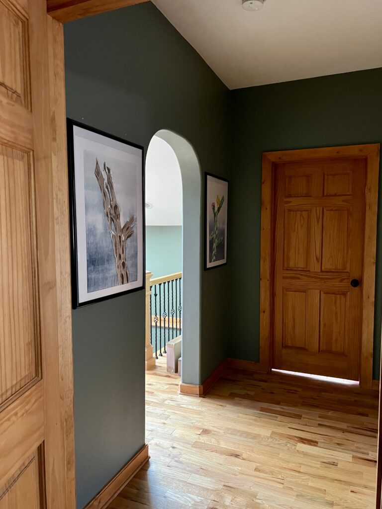 A hallway painted with BM Cambridge Green wall paint.