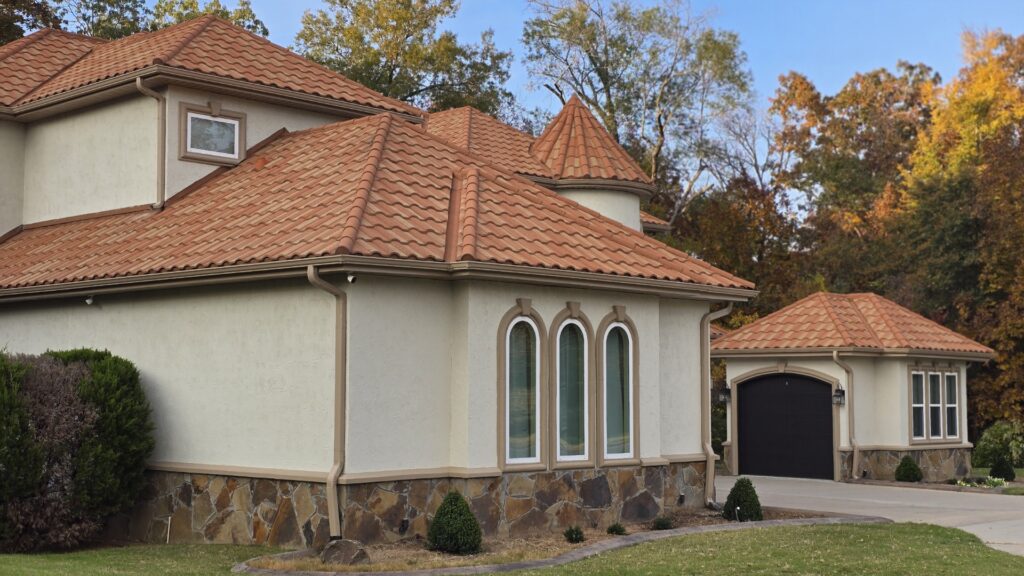 A home is painted with SW Grecian Ivory siding and SW Song Thrush exterior trim.